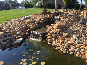 waterfeature retainer wall patio outdoor kitchen New construction Low Voltage Lighting Landscaping Landscapes Irrigation Hardscaping Glade fireplace firepit faux rock Fairfield curb Cumberland county Crossville Landscaping Crossville concrete